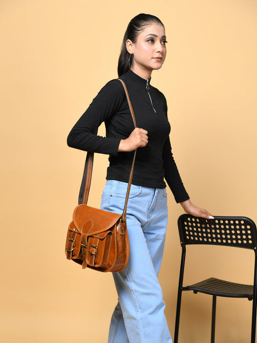 Black 2-pocket leather crossbody bag for women by Classy Leather Bags, featuring adjustable strap and compact design.