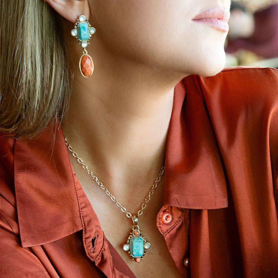 Barse Jewelry blue turquoise and orange coral pendant earrings with gold accents showcasing vibrant, handcrafted jewelry design.