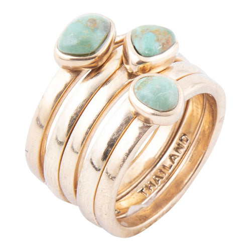 Set of blue turquoise and golden stacking rings by Barse Jewelry, featuring multiple stylish rings for versatile jewelry looks.