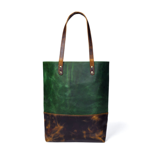 Green women's leather tote handbag from Classy Leather Bags with sturdy handles and spacious interior.