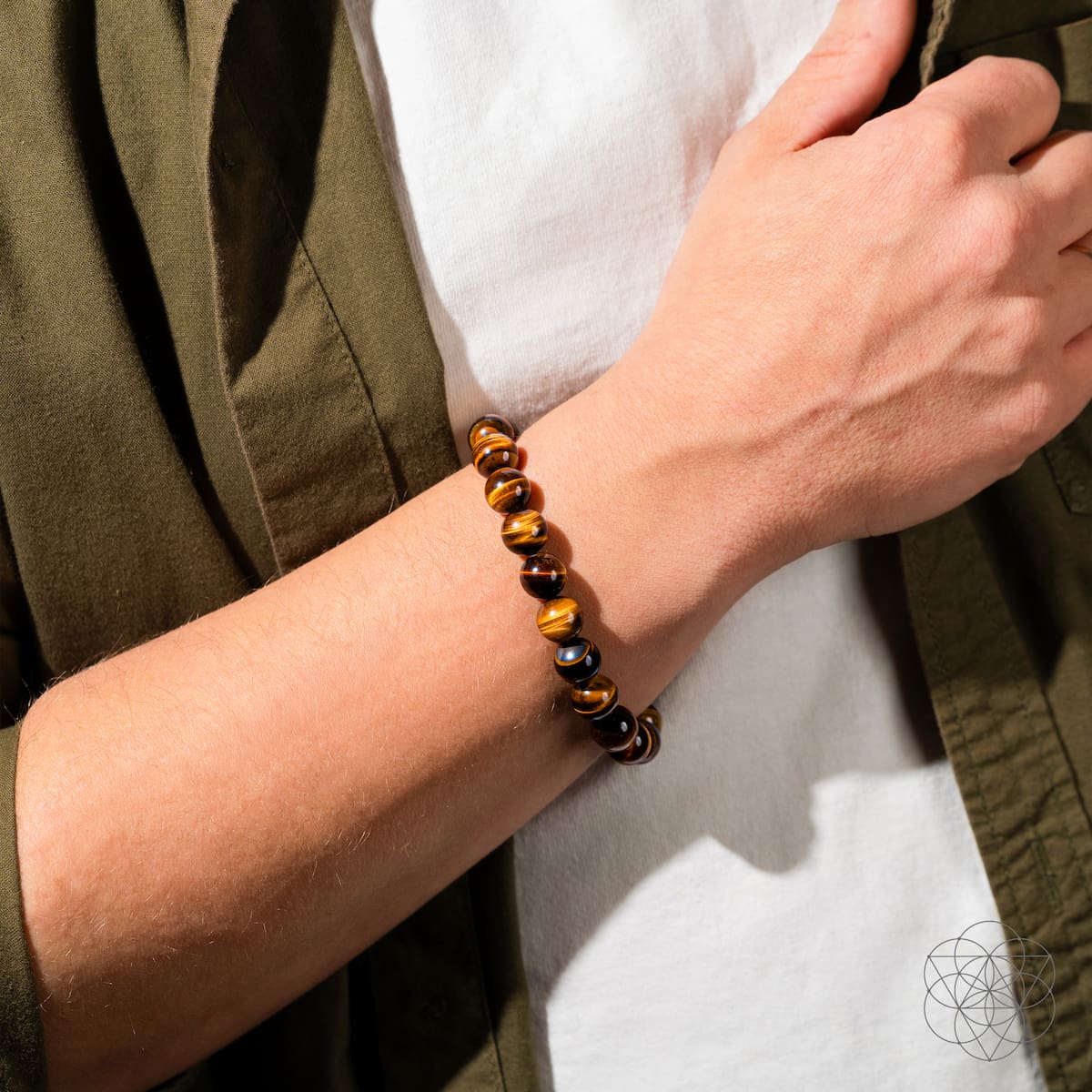Conscious Items built to win 7A grade tiger’s eye bracelet featuring polished tiger’s eye beads on an elastic band.