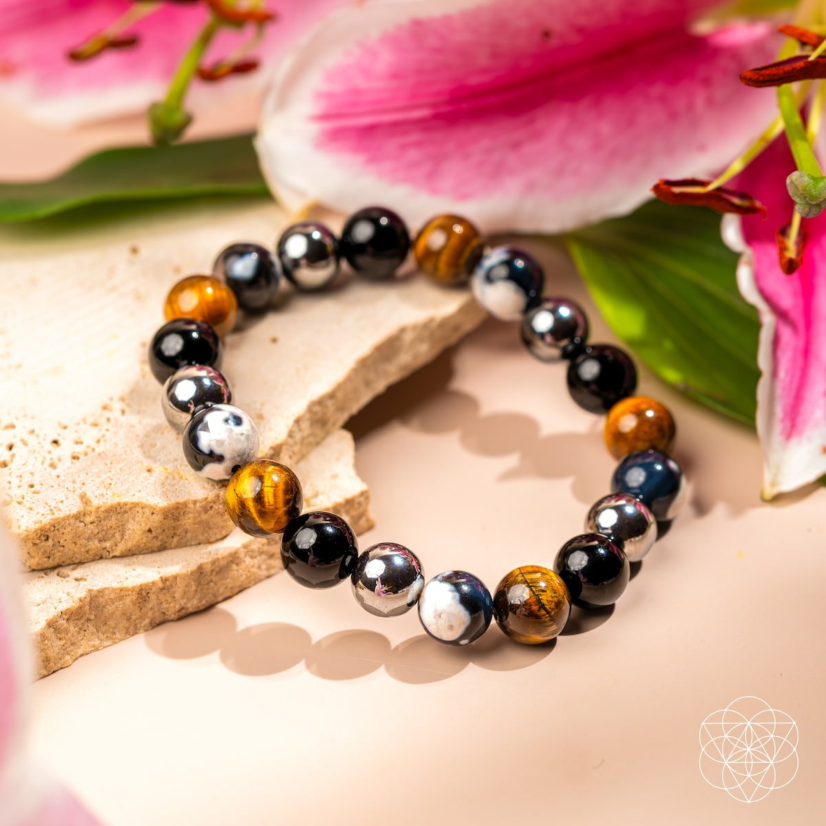 Conscious Items Orca’s Armor bracelet featuring triple protection and healing gemstones on a sleek, adjustable cord style bracelet.