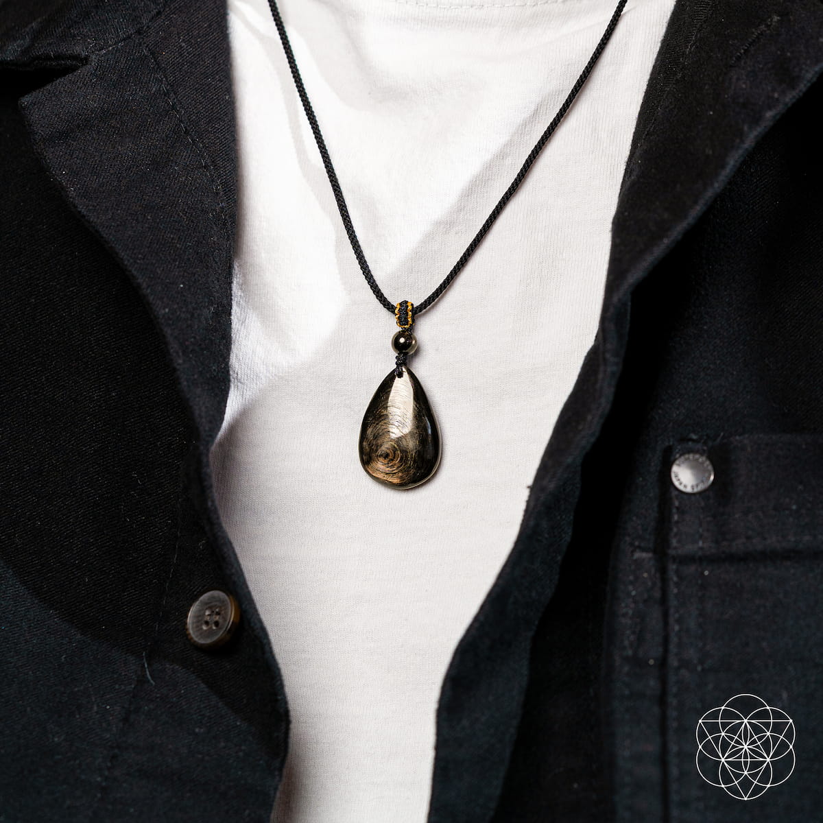Hypersthene millionaire manifestation pendant necklace by Conscious Items featuring a polished Hypersthene stone on a silver chain.