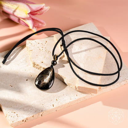 Hypersthene Millionaire Manifestation pendant necklace by Conscious Items featuring a polished stone pendant on a delicate chain.