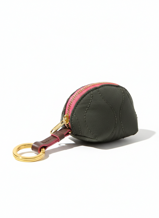 R. Riveter Clara Mini Fatigue Woobie Quilted accessory with a cozy, quilted design in military-inspired fatigue colors.
