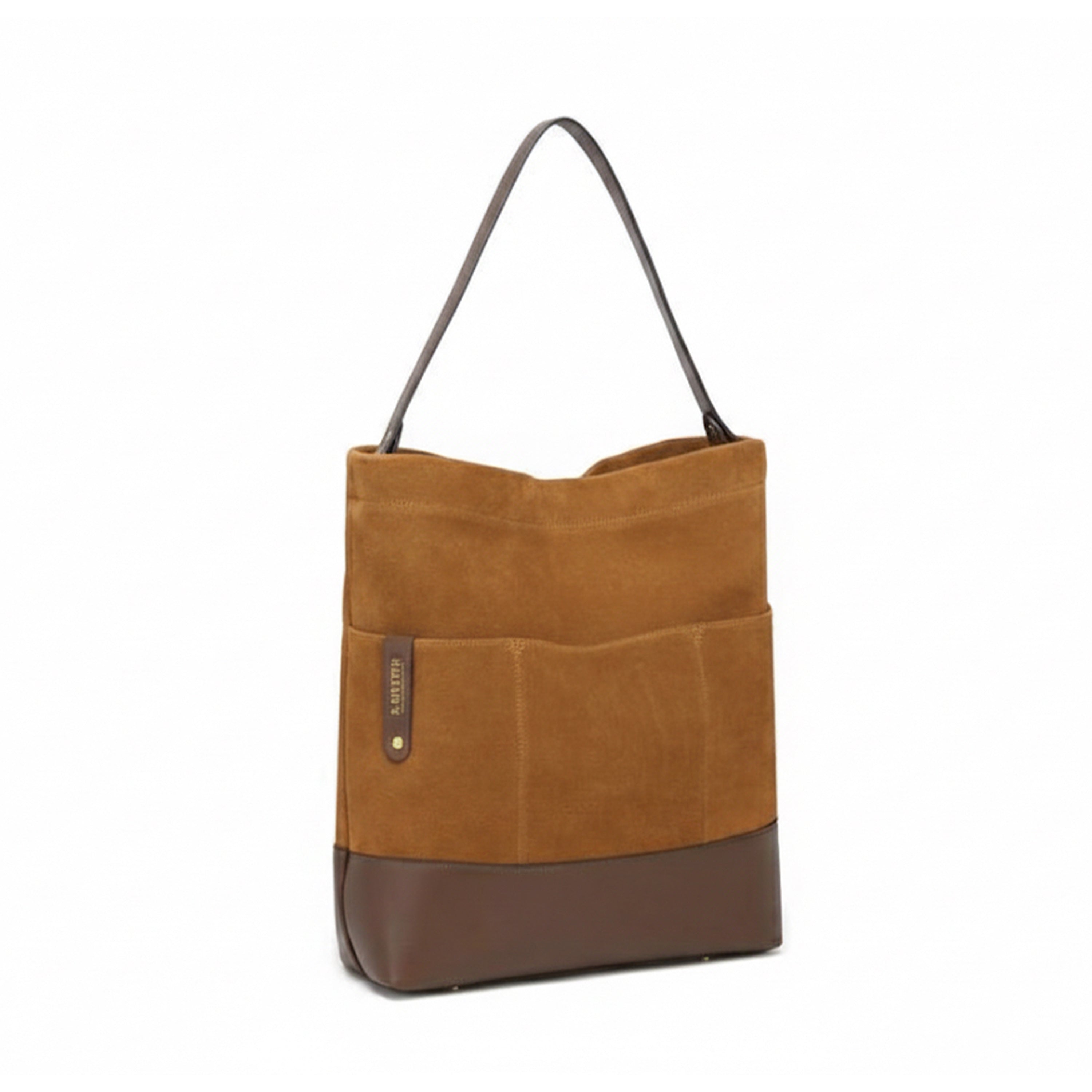R. Riveter Doyle bag in mustard suede and saddle brown leather with modern design and sturdy handles.